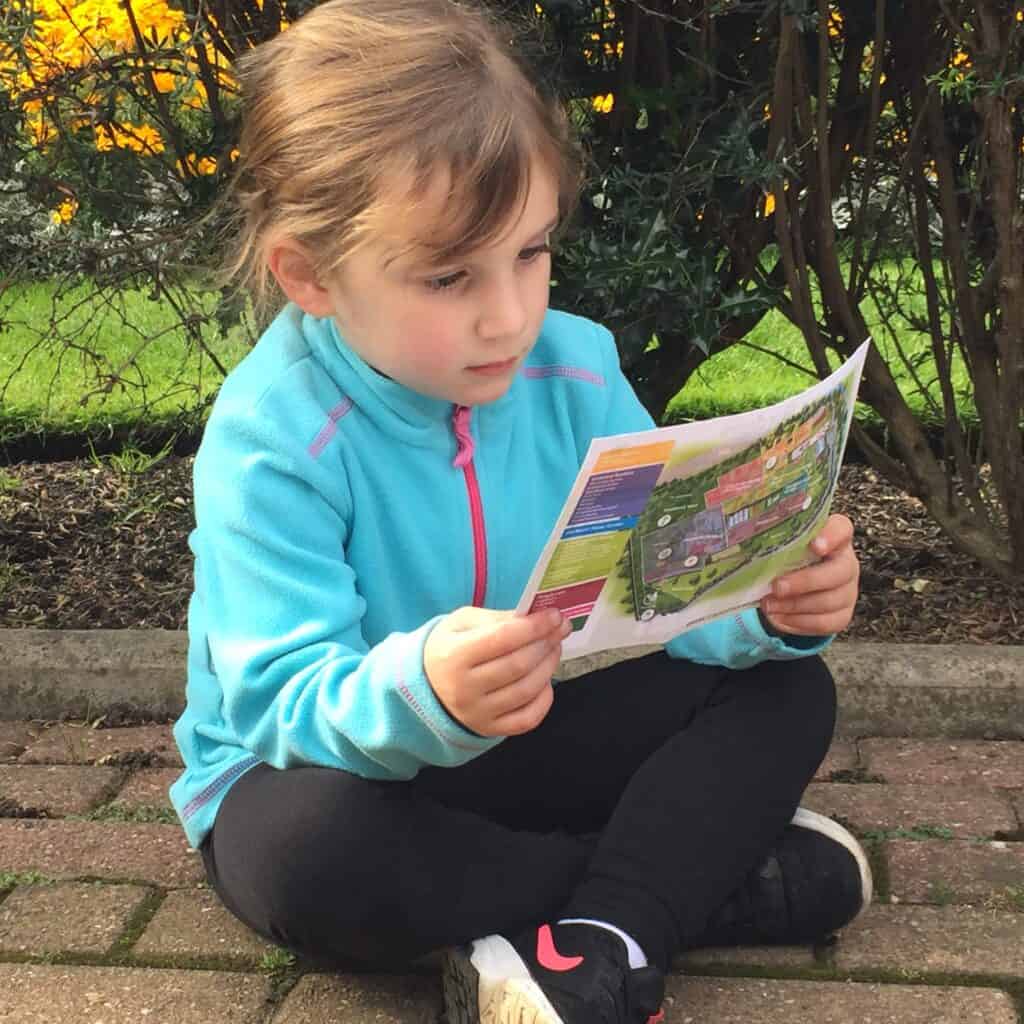 Girl reading trail map 