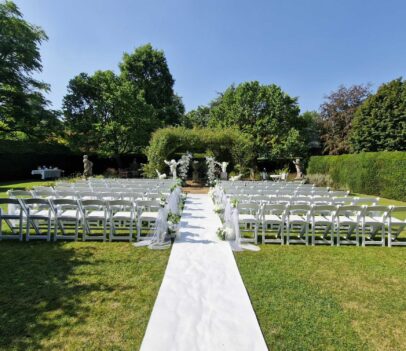 Garden with chairs laid out for a wedding