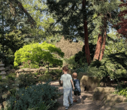 Children exploring the lush gardens during May Half-Term activities at Capel Manor Gardens.