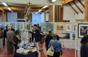 People looking at art exhibition