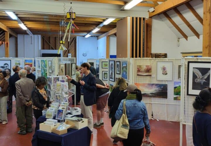 People looking at art exhibition